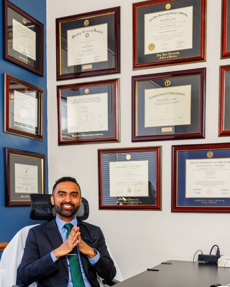 Dr. Tony Mathews seated with steepled hands in front of diploma wall. Visual authority signal for Sequoia Medical 360 member reviews and narratives.