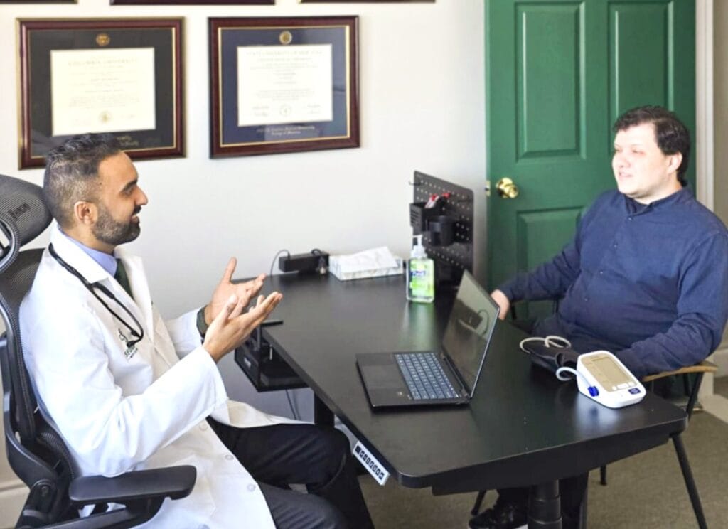 Dr. Mathews discusses personalized health results and next steps with a patient during a Sequoia Medical 360 consultation, translating insights into an actionable longevity plan.